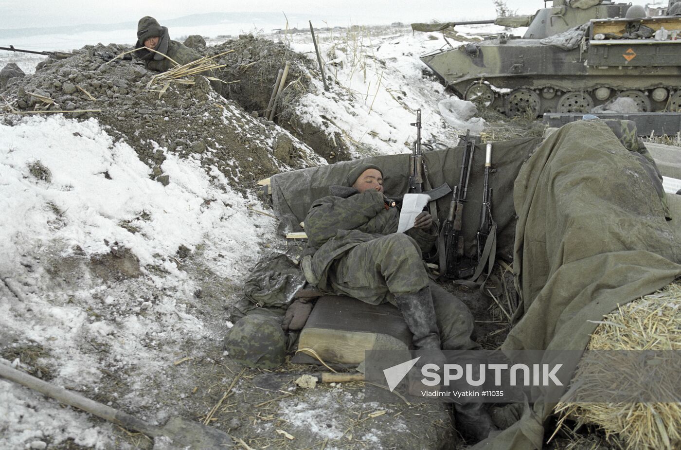 SOLDIERS CHECKPOINT LETTER WEAPONS ARMOURED VEHICLE