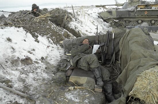 SOLDIERS CHECKPOINT LETTER WEAPONS ARMOURED VEHICLE
