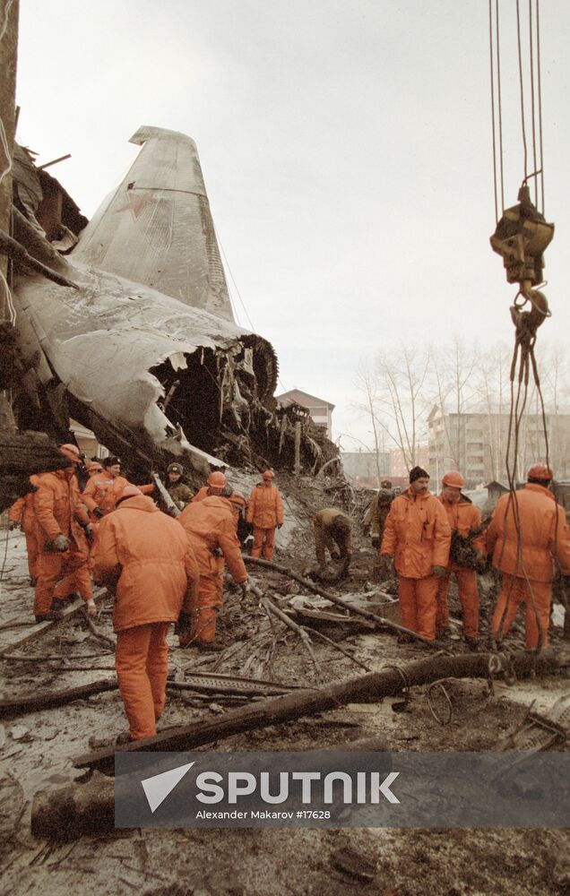 RESCUERS WORK AIRCRAFT WRECKAGE