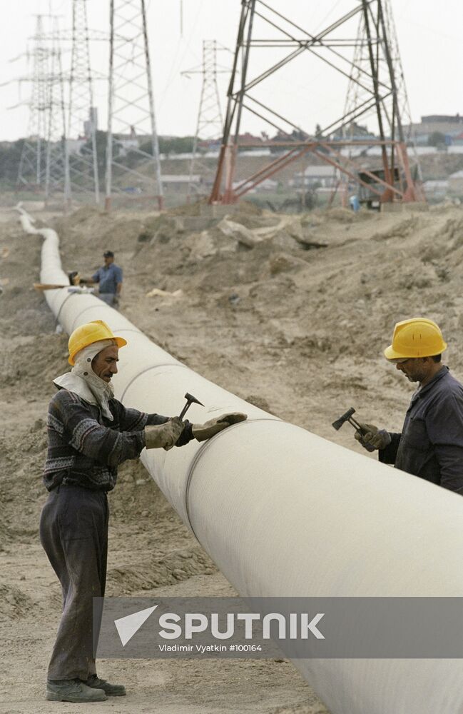 Pipes Workers Power Transmission Line