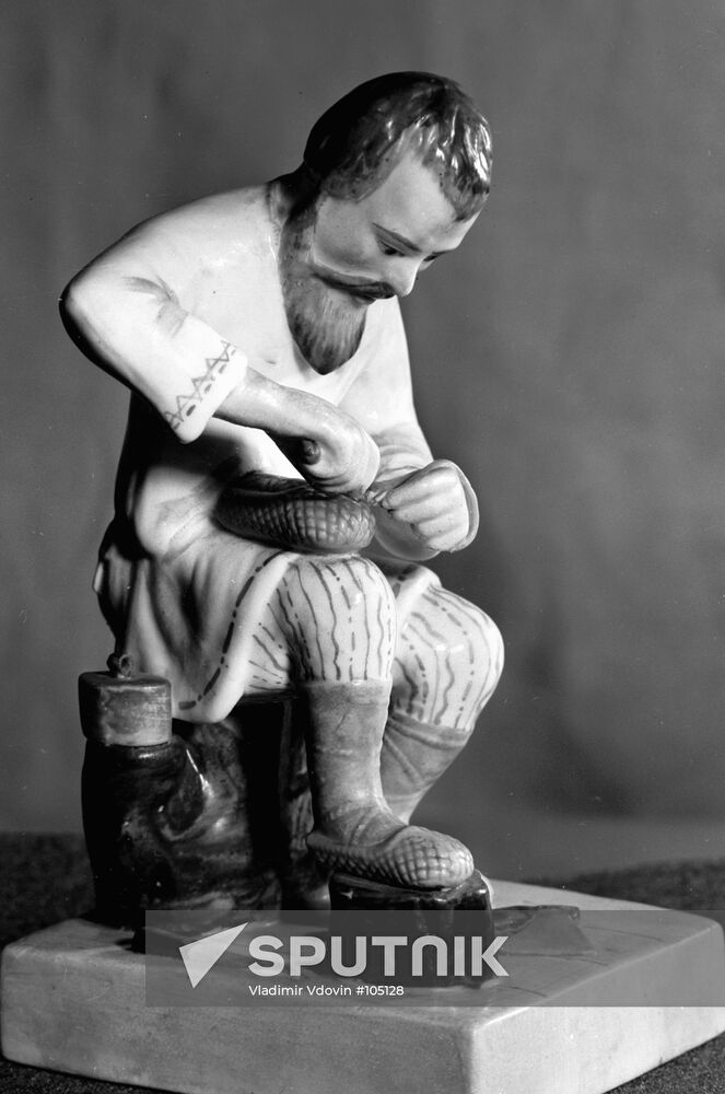 "A MAN MAKING BAST SHOES" PORCELAIN