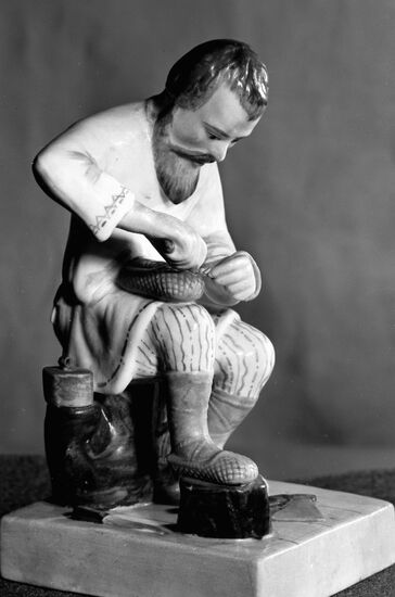"A MAN MAKING BAST SHOES" PORCELAIN