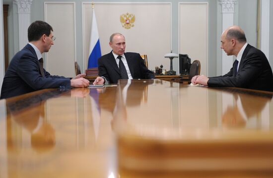 Vladimir Putin meets with Igor Shchegolev and Anton Siluanov