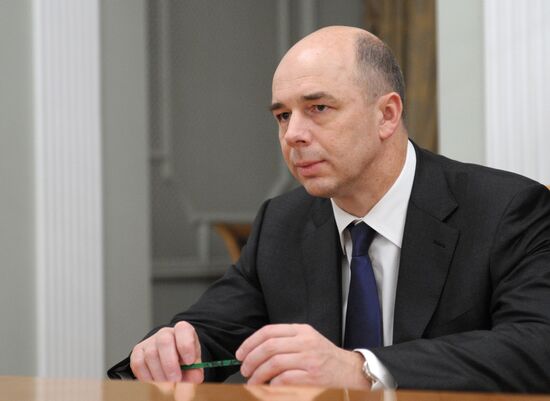 Vladimir Putin meets with Igor Shchegolev and Anton Siluanov