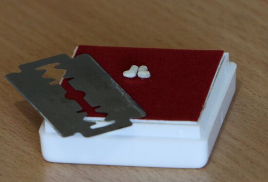 Microminiaturist Anatoly Konenko makes smallest felt boots