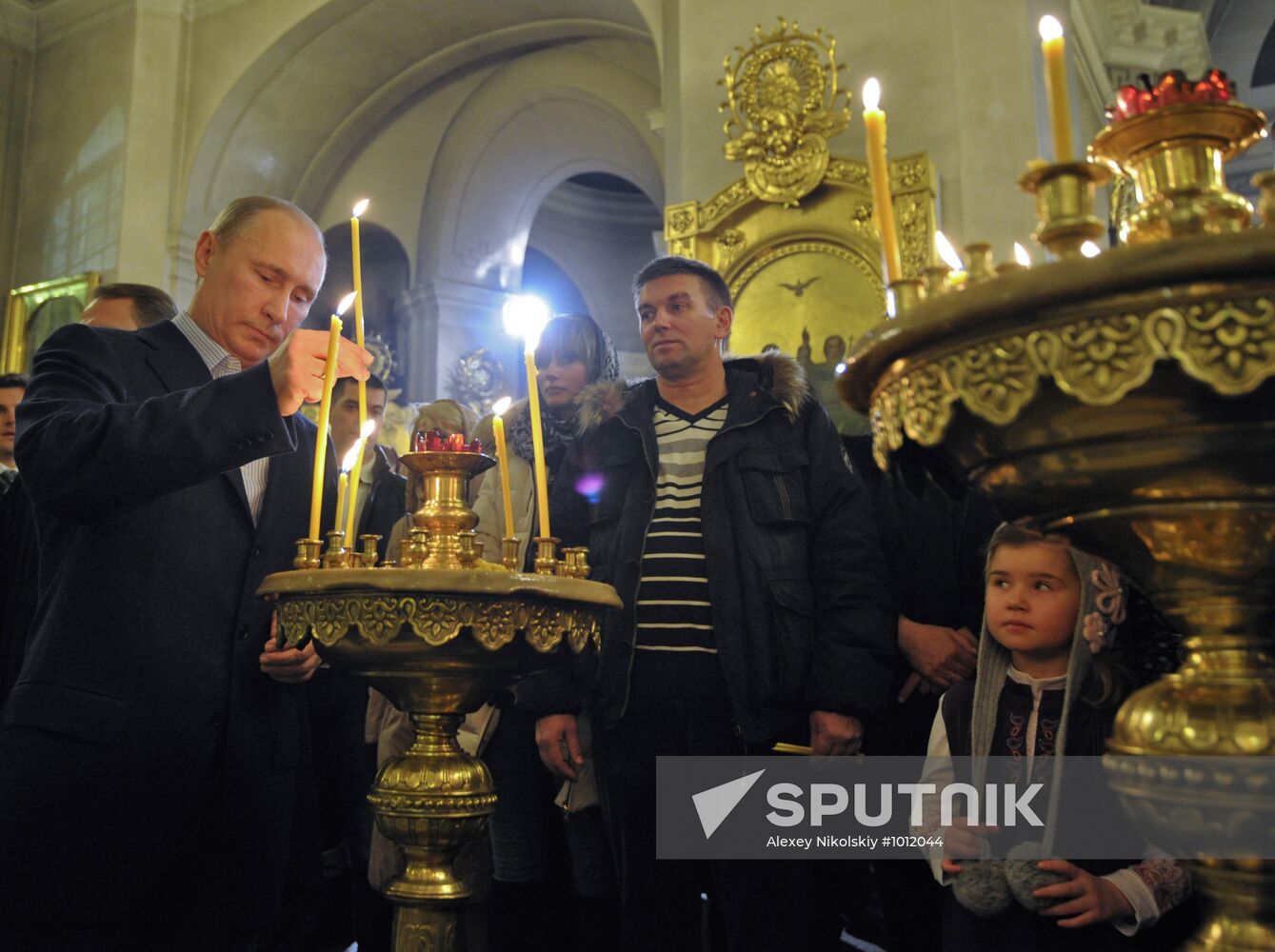 Vladimir Putin at Christmas service in St. Petersburg