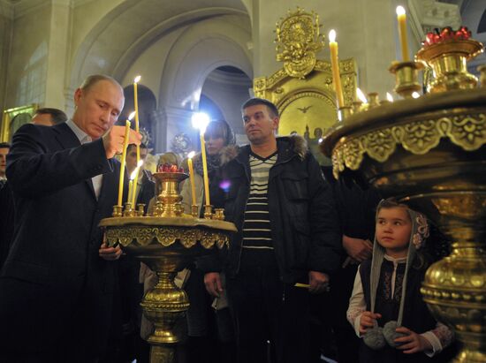 Vladimir Putin at Christmas service in St. Petersburg