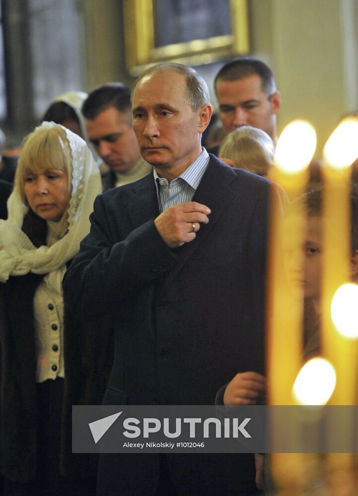 Vladimir Putin at Christmas service in St. Petersburg