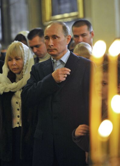 Vladimir Putin at Christmas service in St. Petersburg