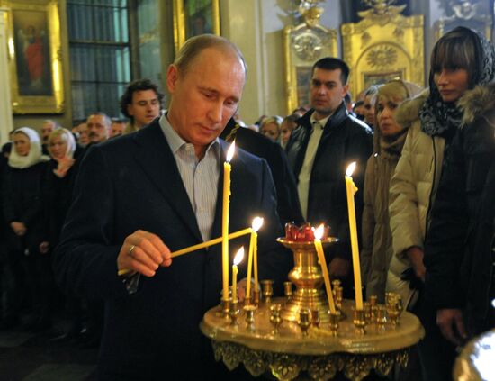 Vladimir Putin at Christmas service in St. Petersburg