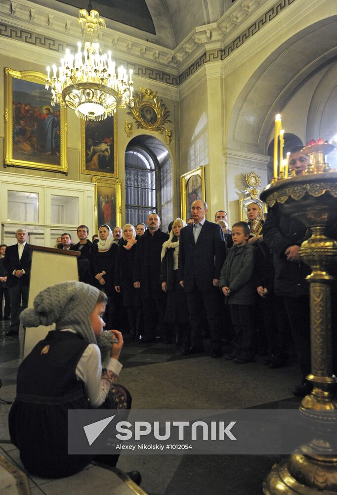 Vladimir Putin at Christmas service in St. Petersburg