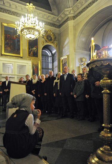 Vladimir Putin at Christmas service in St. Petersburg