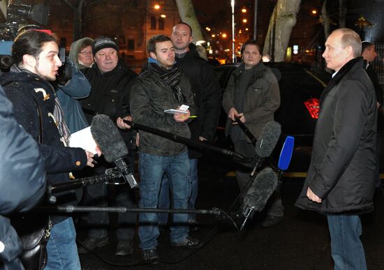 Vladimir Putin at Christmas service in St. Petersburg