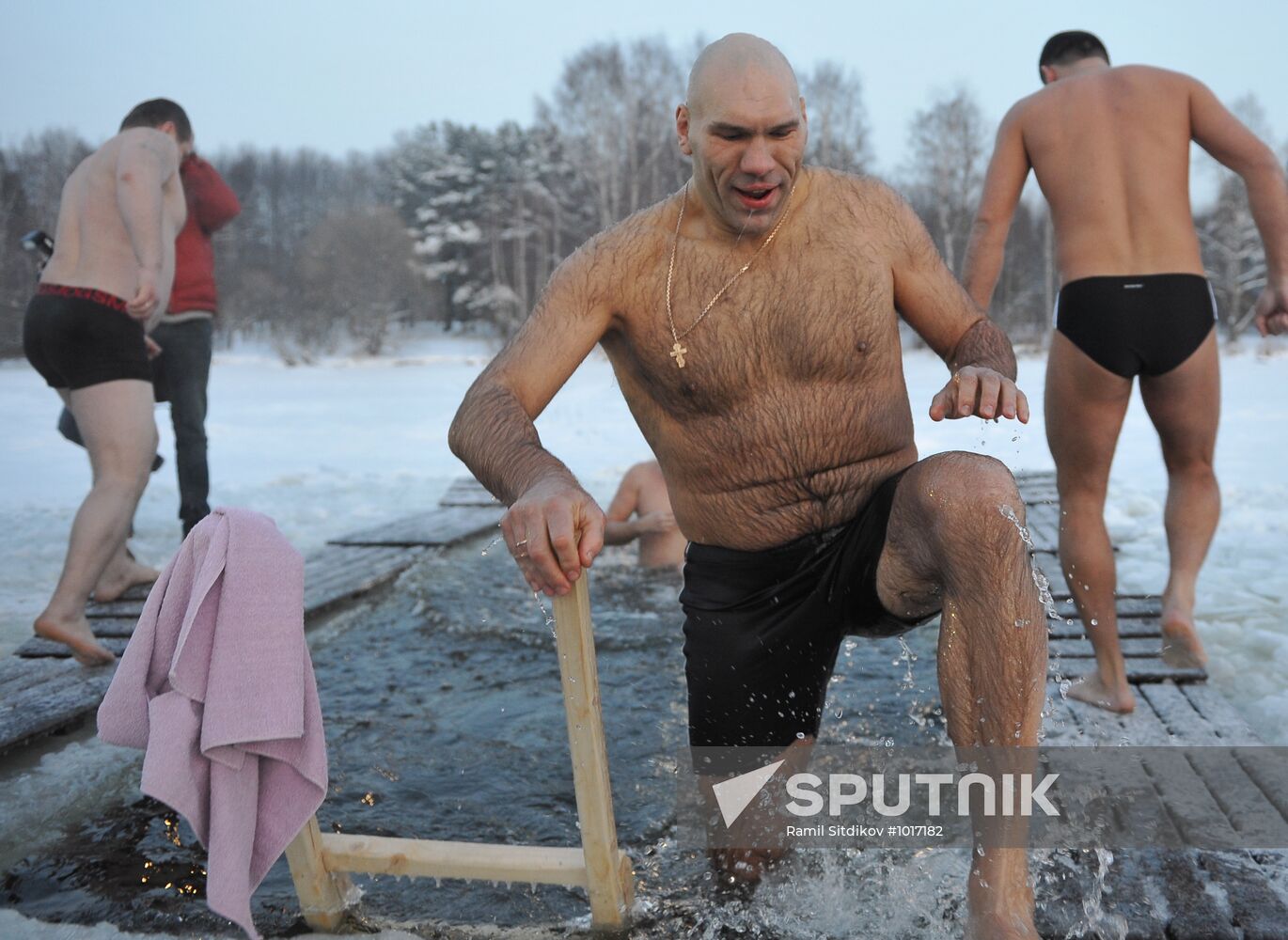 Nikolai Valuyev bathing in ice hole on Epiphany