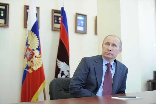 Vladimir Putin visits Federal Migration Service