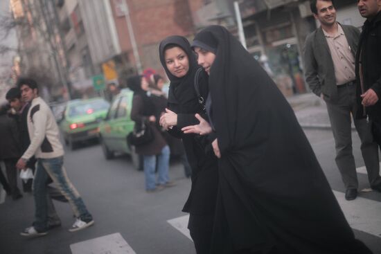 Resident of Tehran crossing a street