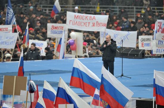 Putin speaks to his supporters at "Defend the Nation!" rally