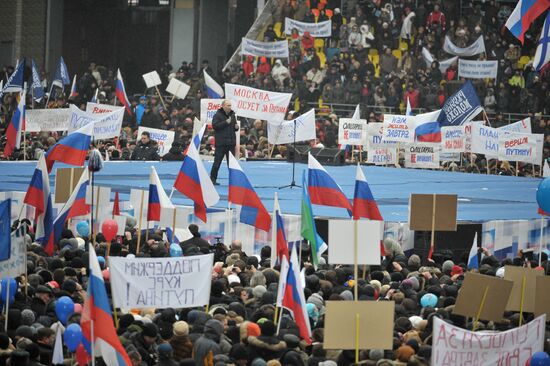 Putin speaks to his supporters at "Defend the Nation!" rally