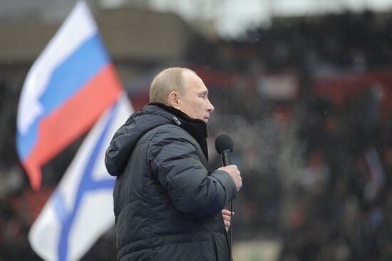 Putin speaks to his supporters at "Defend the Nation!" rally