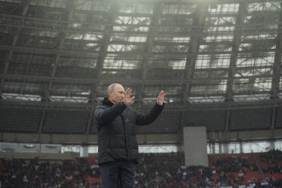 Vladimir Putin speaks to supporters at "Defend the Nation!"rally