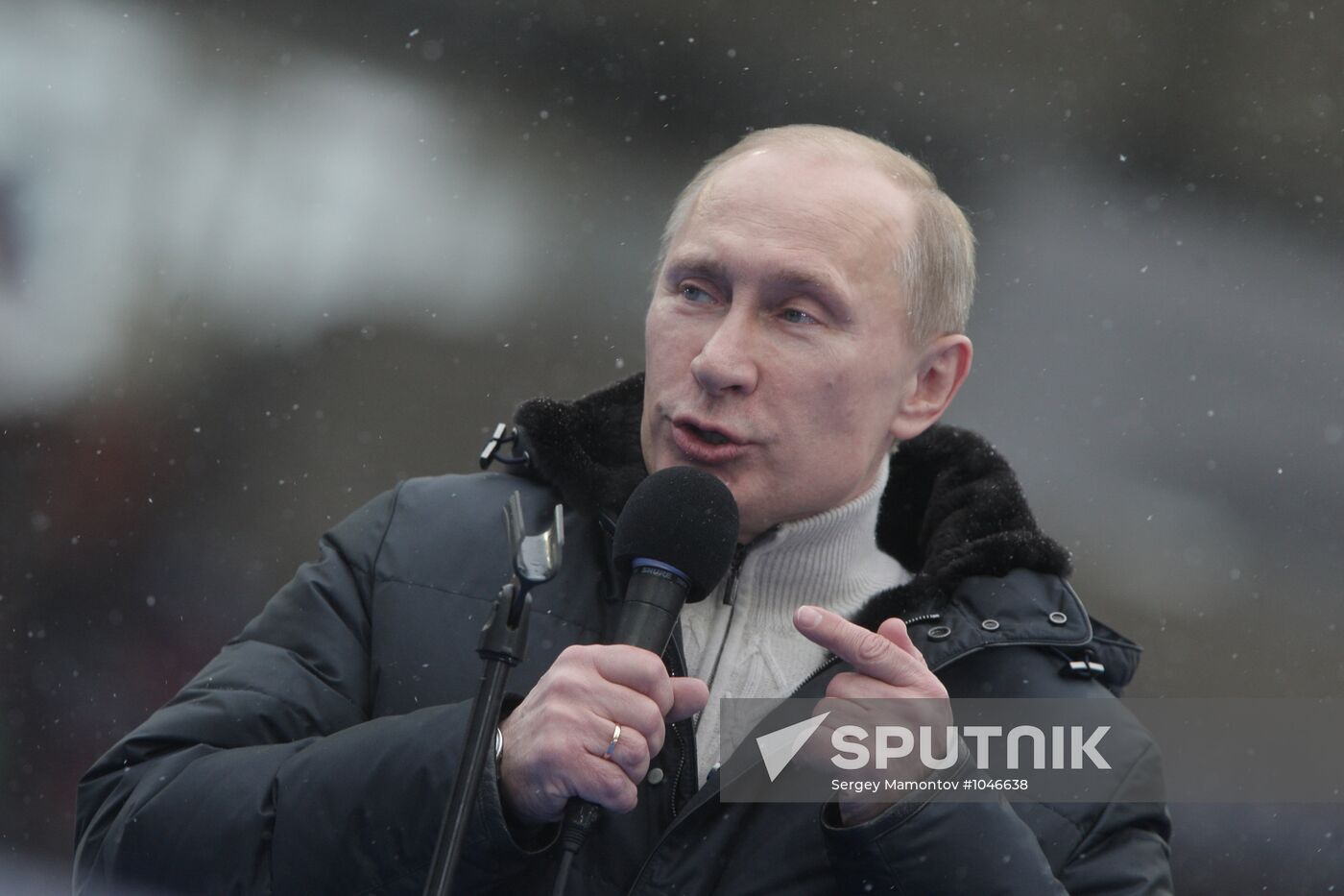 Vladimir Putin speaks to supporters at "Defend the Nation!"rally