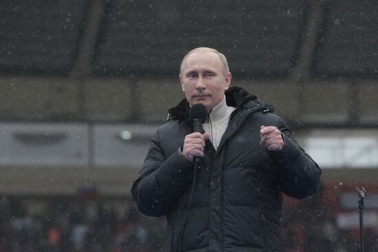 Vladimir Putin speaks to supporters at "Defend the Nation!"rally