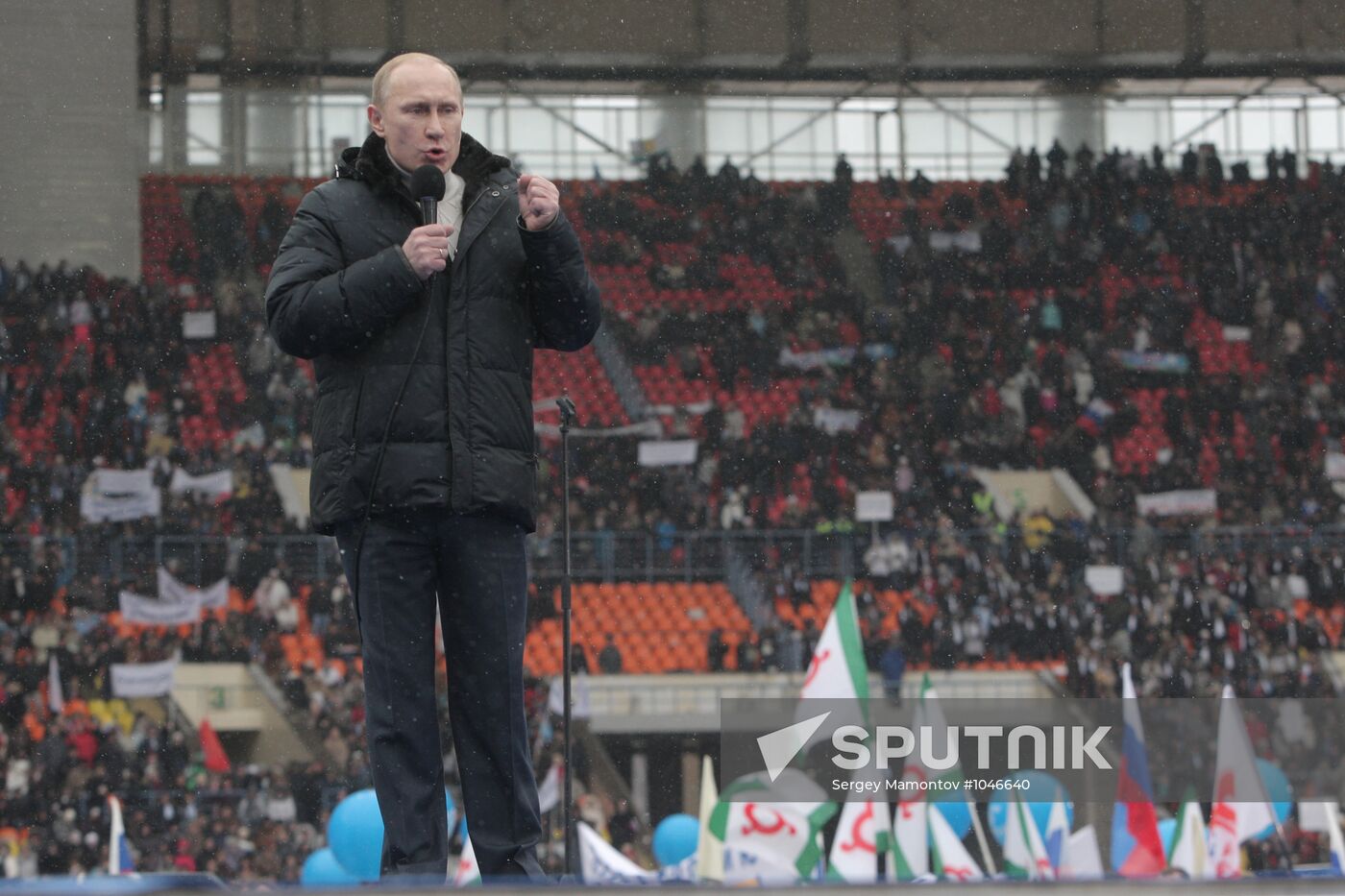 Vladimir Putin speaks to supporters at "Defend the Nation!"rally