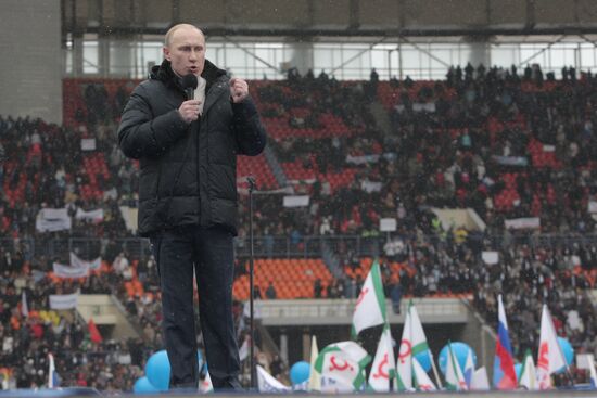 Vladimir Putin speaks to supporters at "Defend the Nation!"rally
