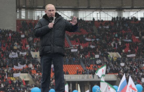 Vladimir Putin speaks to supporters at "Defend the Nation!"rally