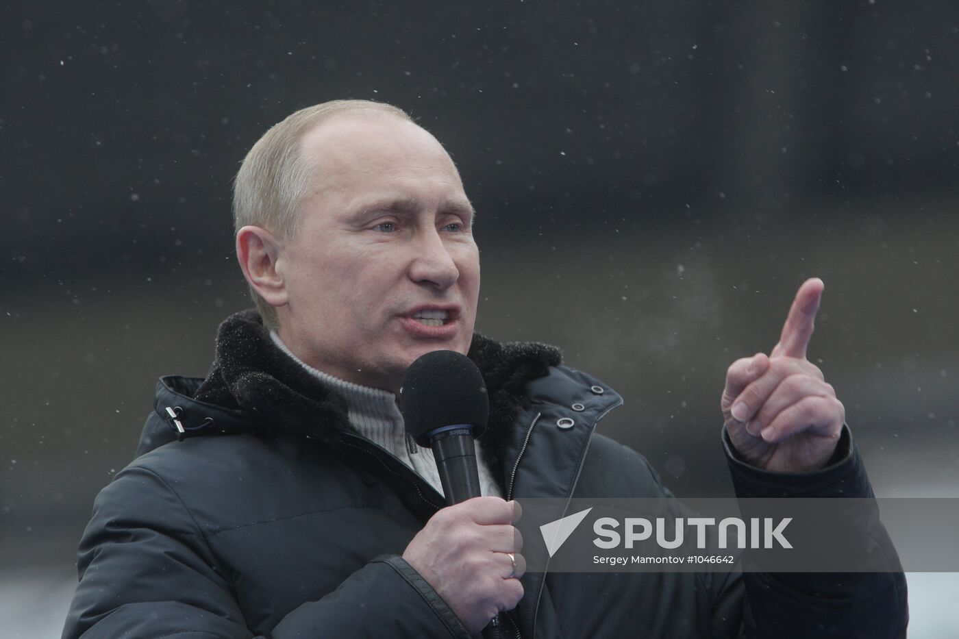 Vladimir Putin speaks to supporters at "Defend the Nation!"rally