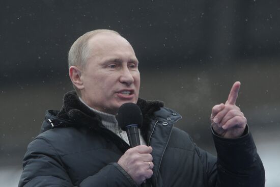 Vladimir Putin speaks to supporters at "Defend the Nation!"rally