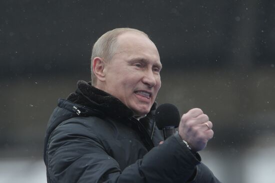 Vladimir Putin speaks to supporters at "Defend the Nation!"rally