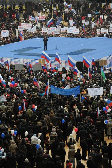 Putin speaks to his supporters at "Defend the Nation!" rally