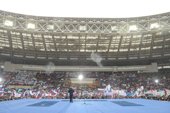 Putin addresses his supporters at "Defend the Nation!" rally