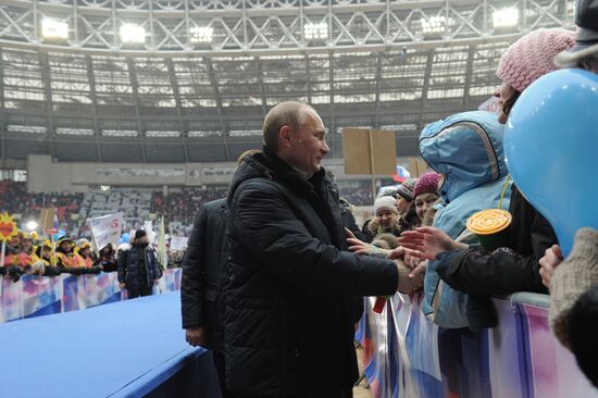 Putin addresses his supporters at "Defend the Nation!" rally