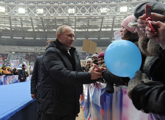 Putin addresses his supporters at "Defend the Nation!" rally