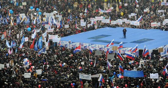 Putin speaks to his supporters at "Defend the Nation!" rally