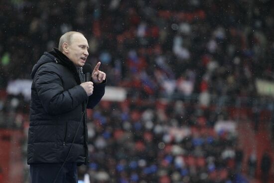 Putin speaks to his supporters at "Defend the Nation!" rally
