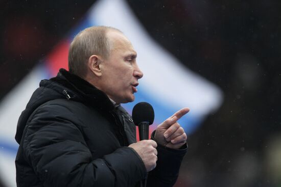 Putin speaks to his supporters at "Defend the Nation!" rally