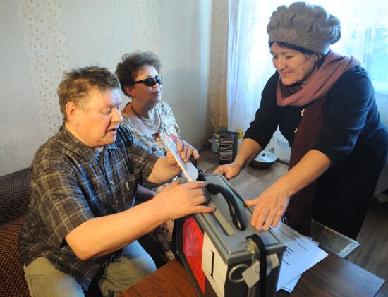 People with impaired eyesight cast their ballots in Chita