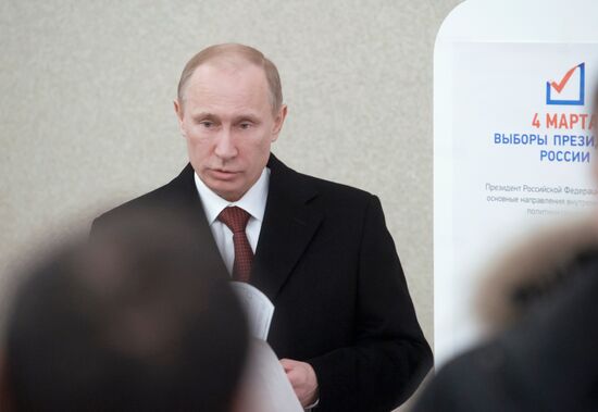 Presidential candidate Vladimir Putin votes
