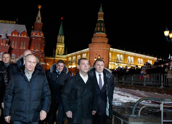 D. Medvedev and V. Putin appear at a rally on Manezh Square