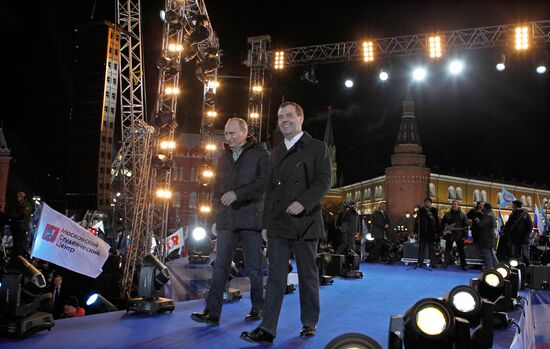 D. Medvedev and V. Putin appear at a rally on Manezh Square