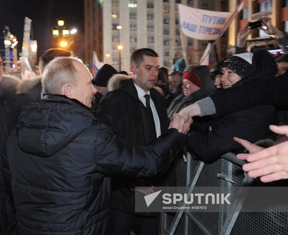 D. Medvedev and V. Putin appear at a rally on Manezh Square