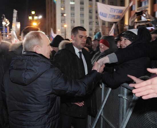 D. Medvedev and V. Putin appear at a rally on Manezh Square