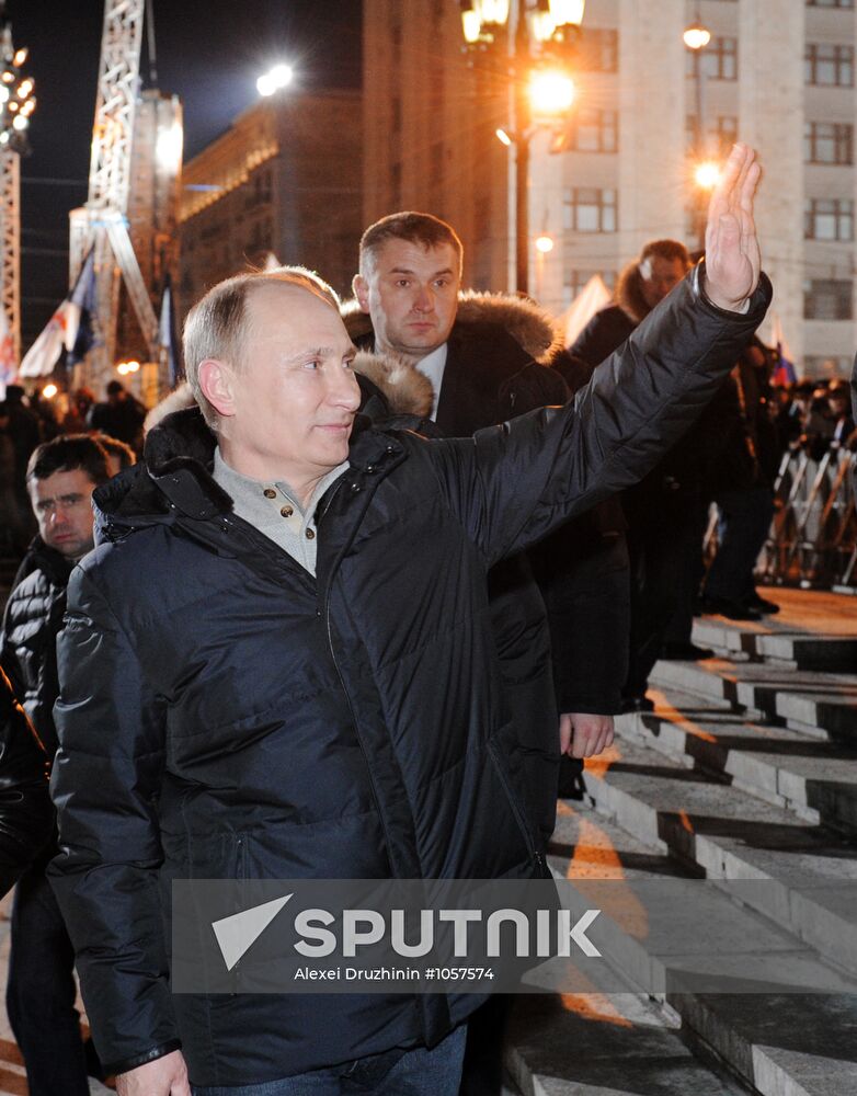 D. Medvedev and V. Putin appear at a rally on Manezh Square