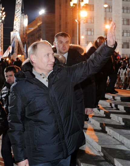 D. Medvedev and V. Putin appear at a rally on Manezh Square