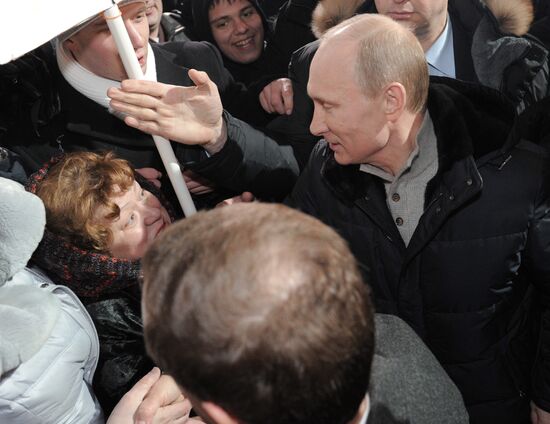 D. Medvedev and V. Putin appear at a rally on Manezh Square