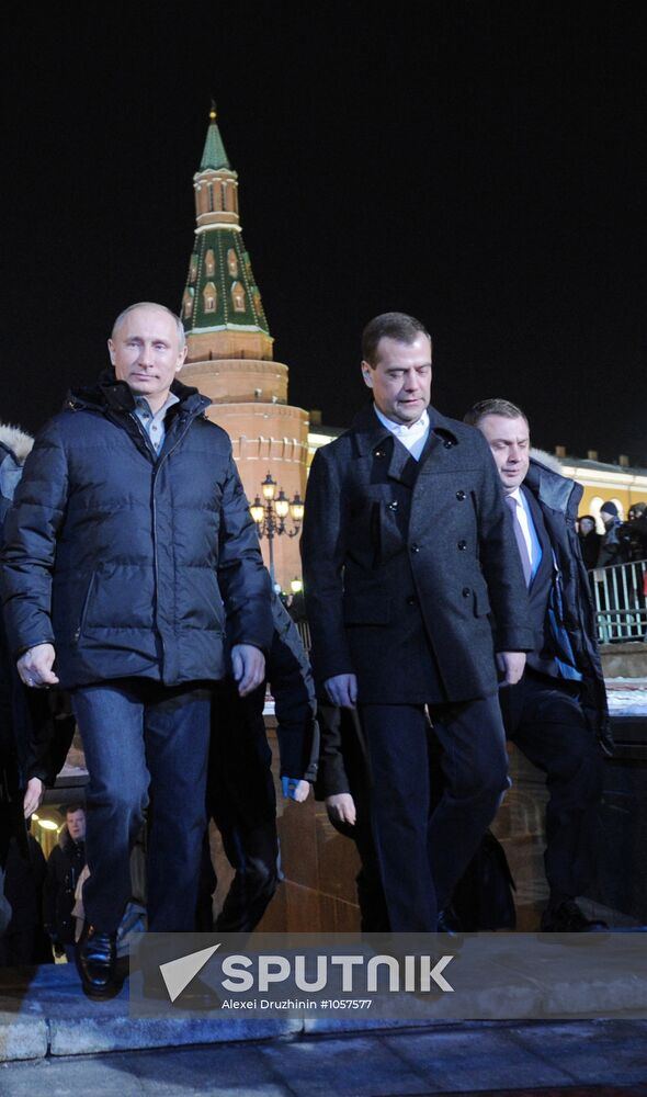 D. Medvedev and V. Putin appear at a rally on Manezh Square