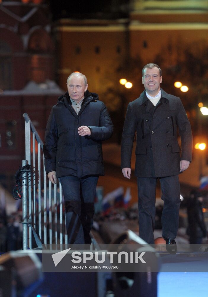 D. Medvedev and V. Putin appear at a rally in Manege Square